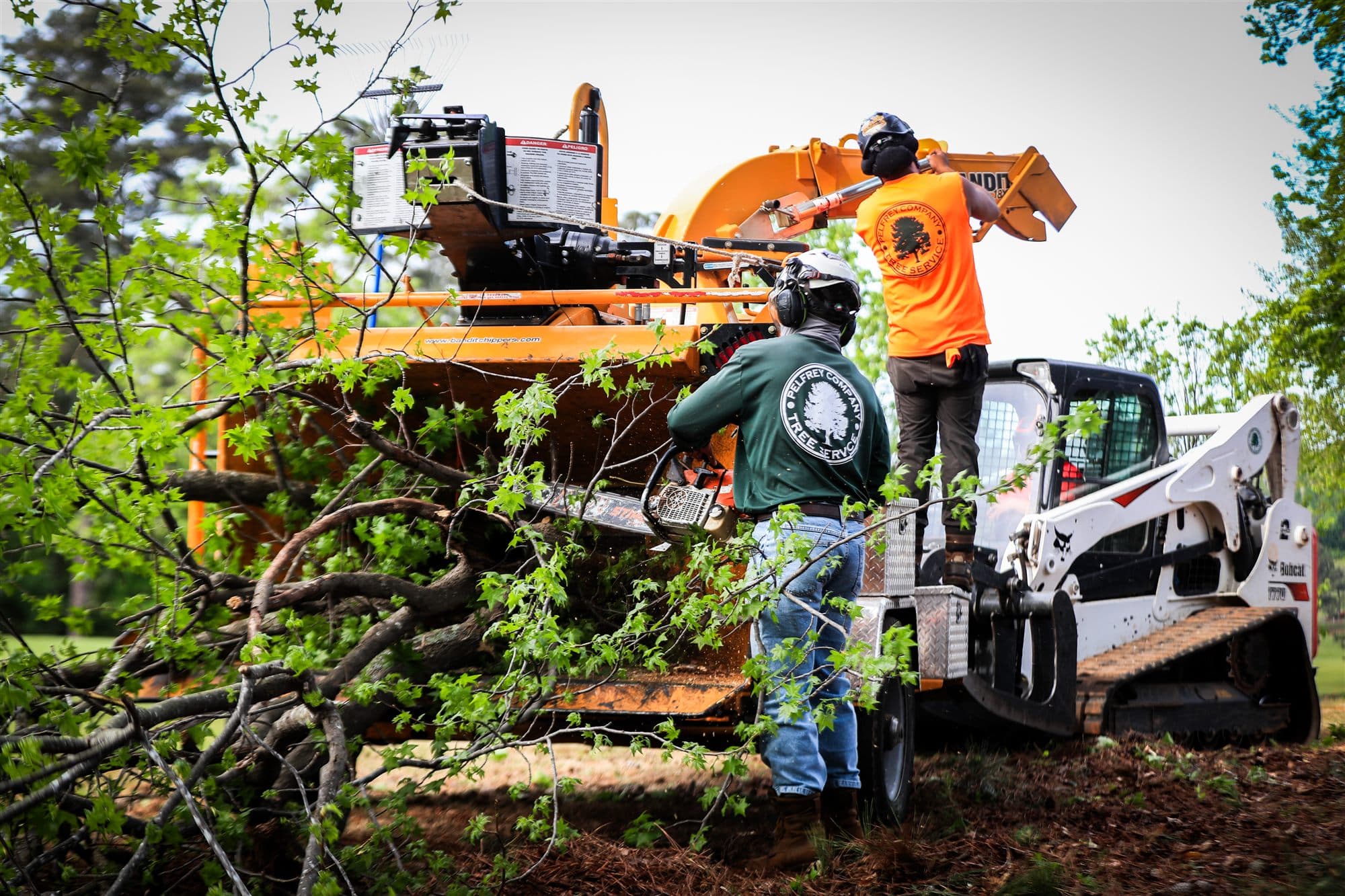 Crew on site with chipper truck