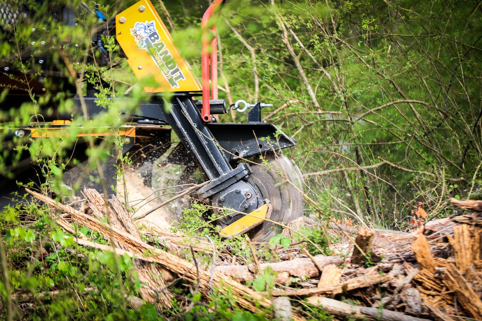 Tracked stump grinding machine on residential property